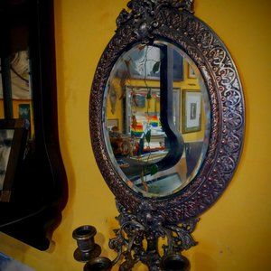 19th Century silvered cast bronze mercury mirrored three candle sconce.